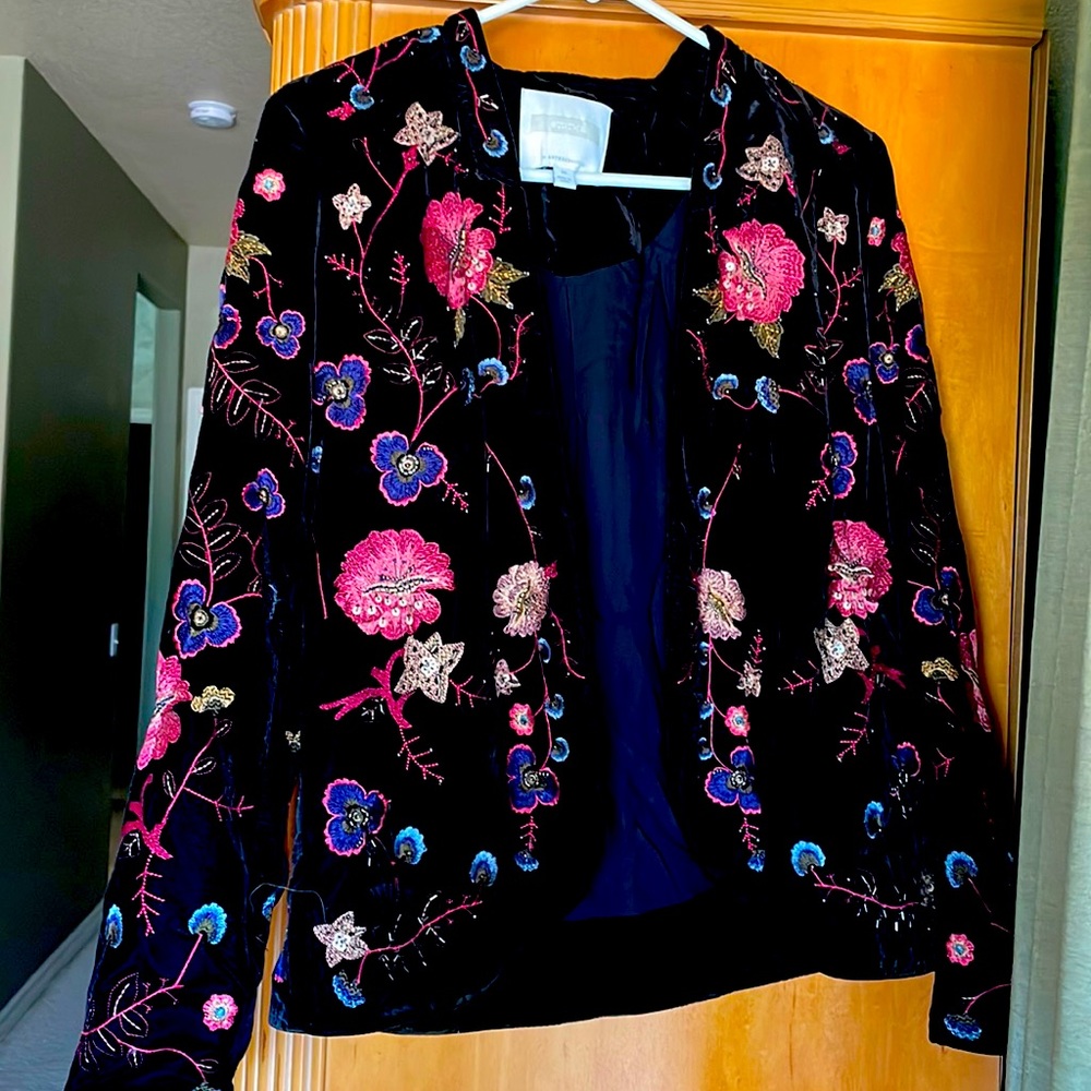 Black velvet jacket with floral embroidery. Excellent condition.